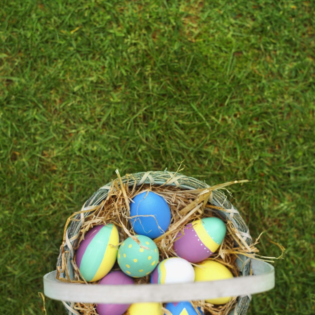 Elevated view of a basket filled with Easter eggs