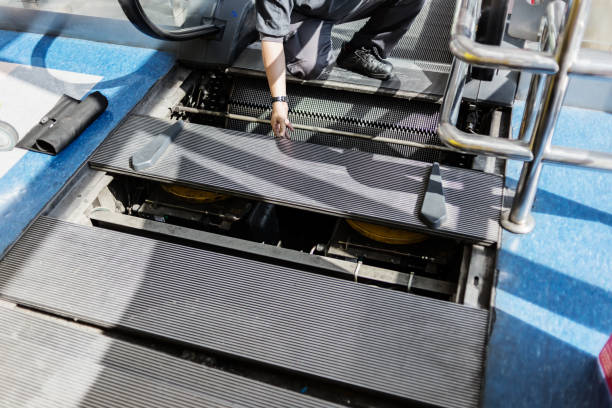 escalator in department store or airport fixing by technician for passenger